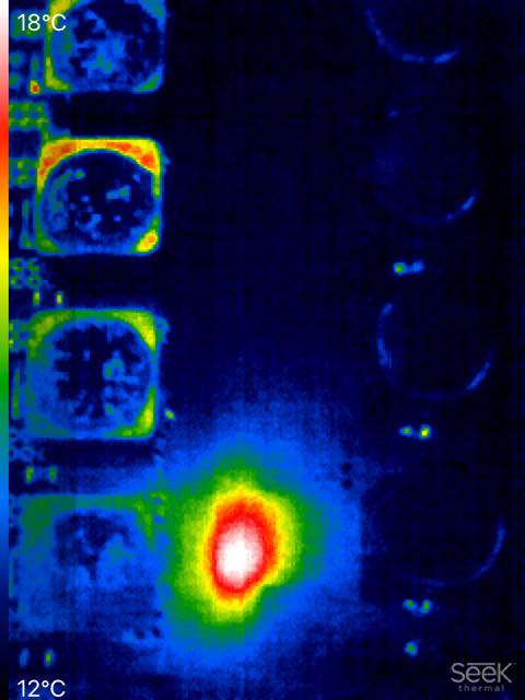 Thermal camera image of PS5 board showing shorted MOSFET found during diagnosis