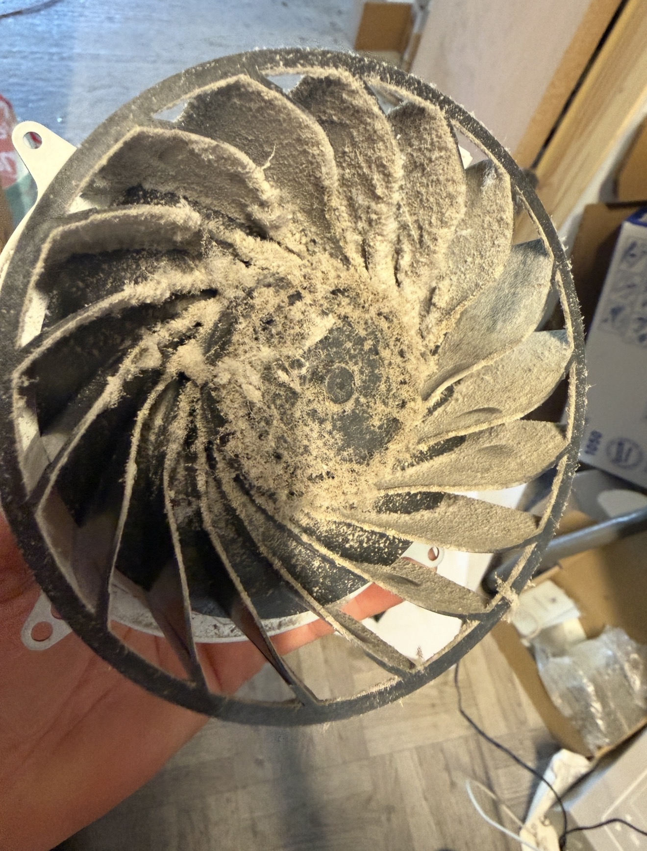 PS5 fan badly clogged with dust before cleaning