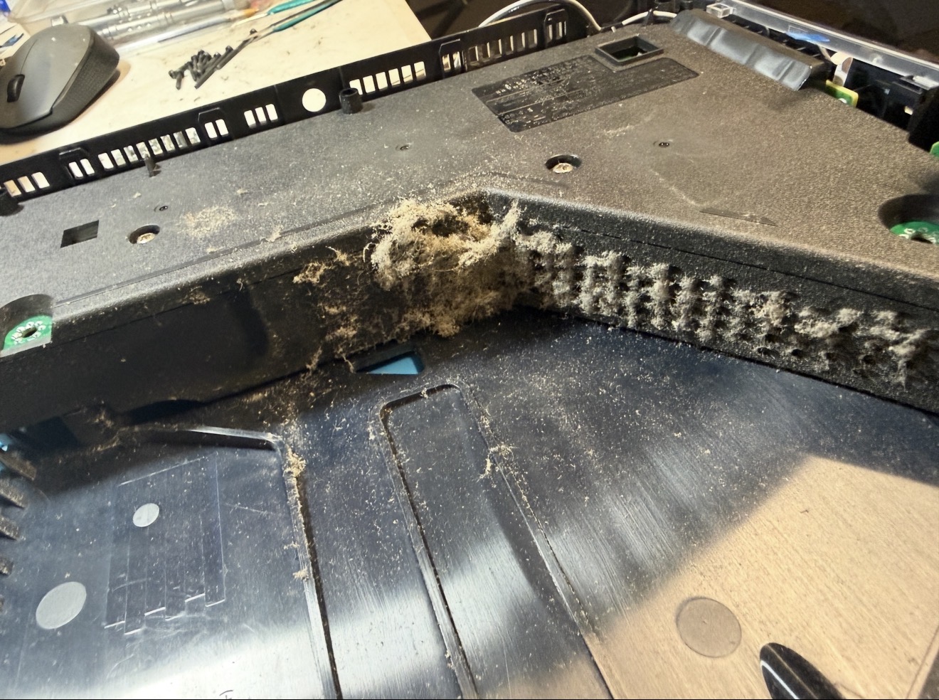 PS5 power supply air vents clogged with dust before cleaning