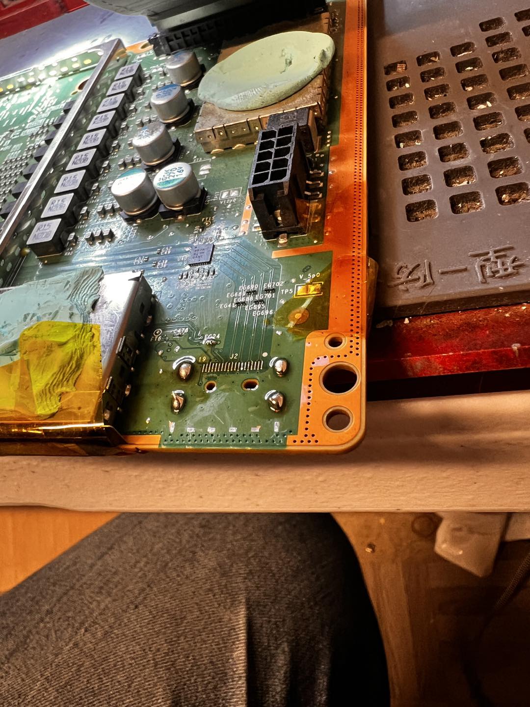 Xbox Series S with damaged HDMI port removed from the board, pads cleaned ready for new port