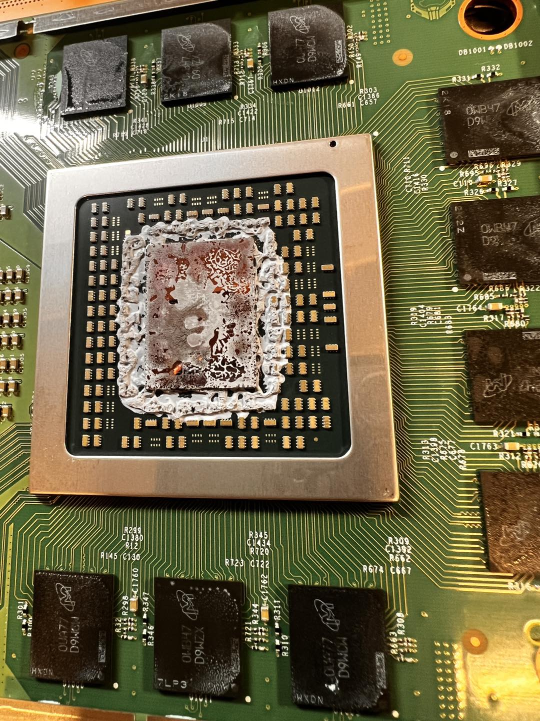 Xbox APU with old dried-out thermal paste — the before of a repaste job